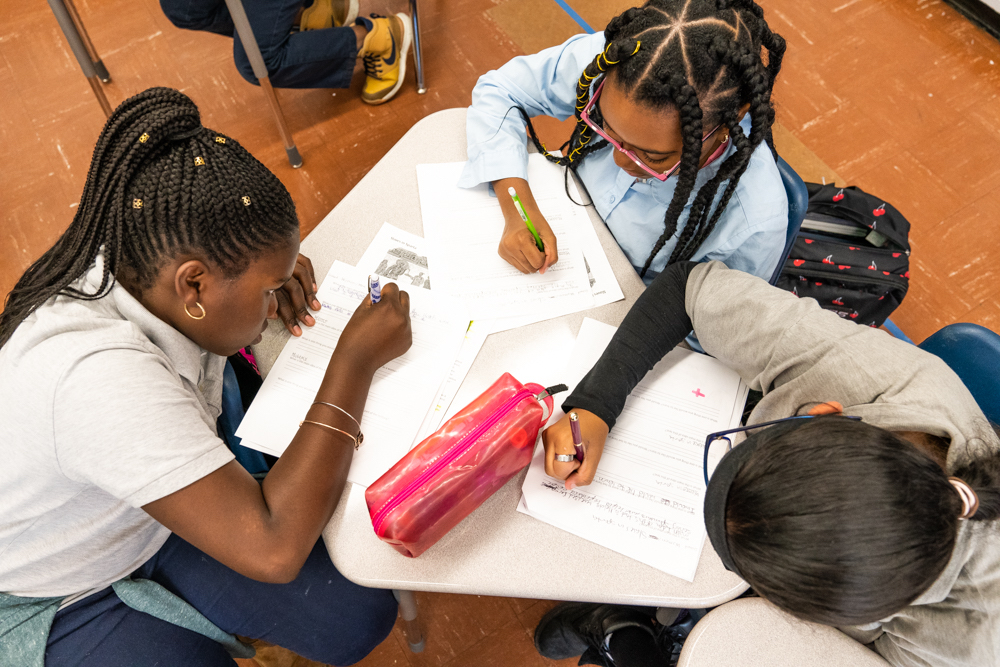 A group of student work together at one of the Explore charter schools