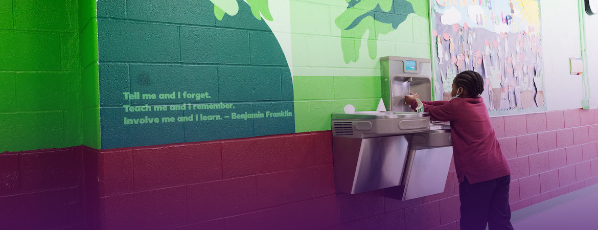 Student in the hallway at Nuasin Next Generation Charter School, partner school of the Teacher Residency program.